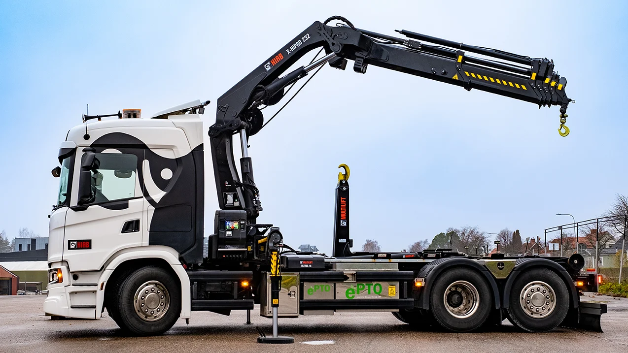 Loader crane hire Brentford unloading pallets from a commercial vehicle in TW8